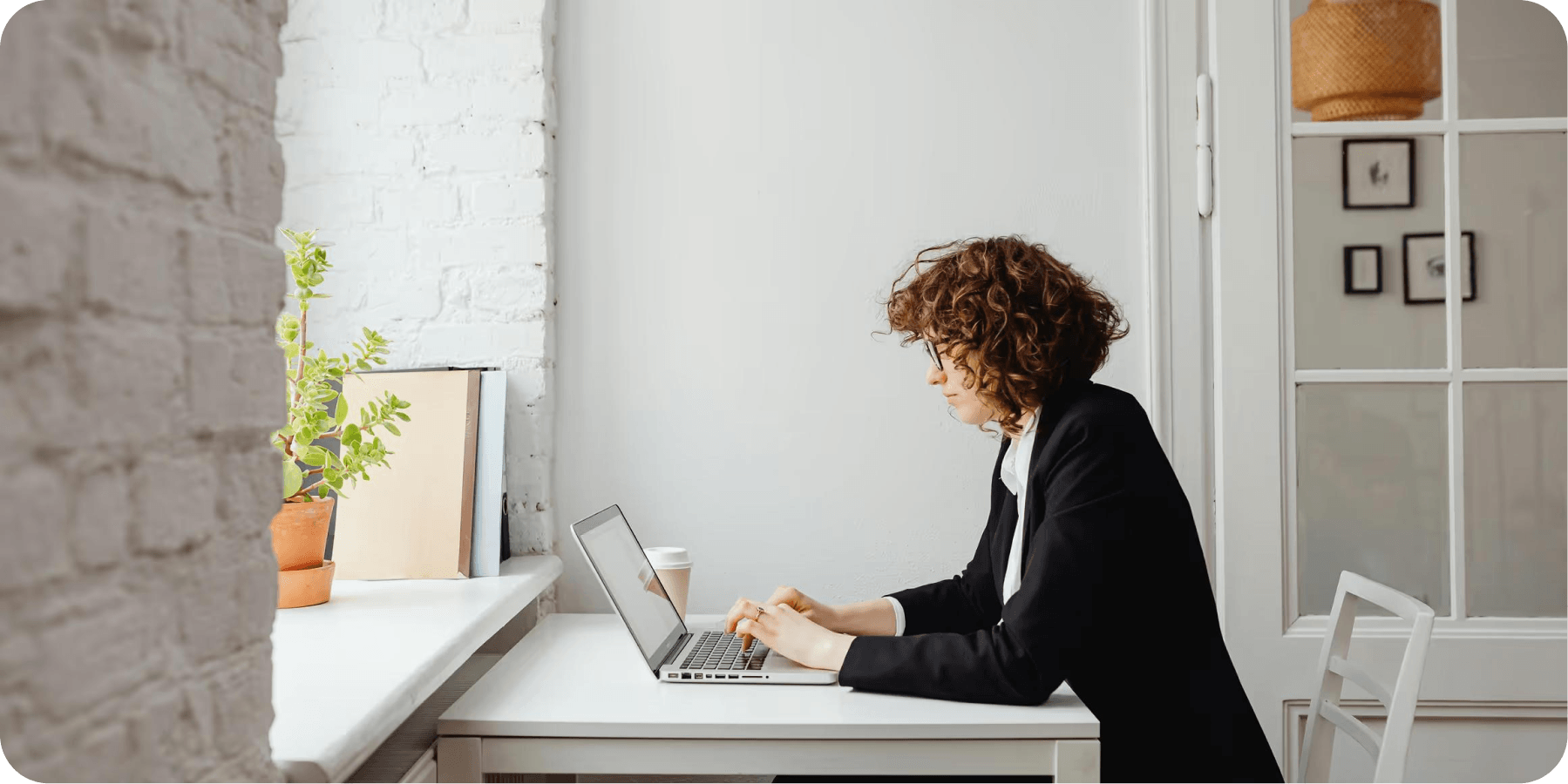 Professional working on a laptop in a modern office