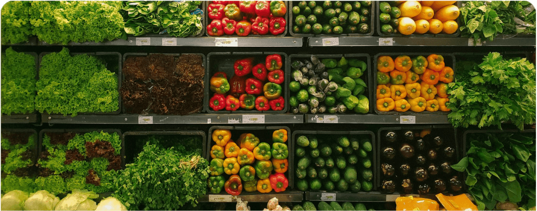 Fresh produce arranged in grocery market crates