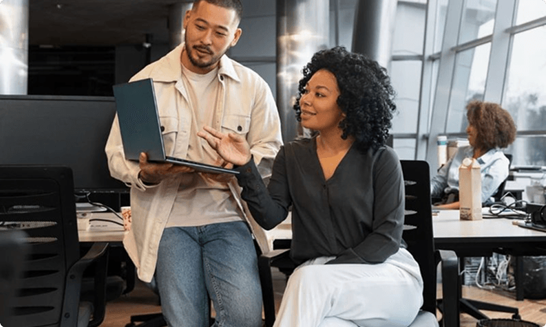 Team collaborating over logistics software in a modern office