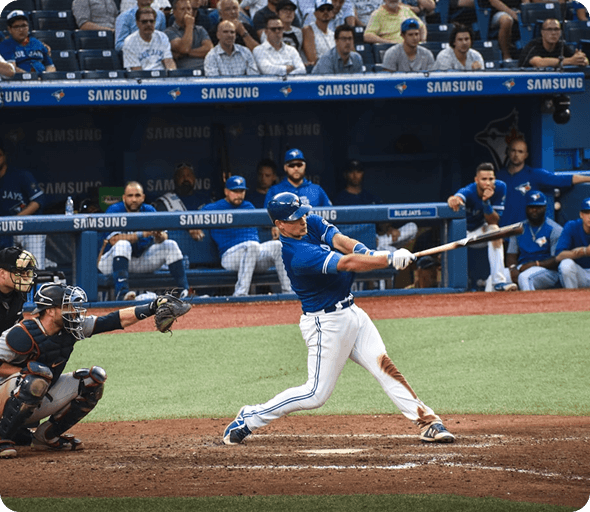 Baseball batter swinging during a stadium game