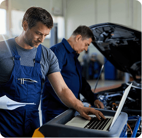 Automotive technicians working on a vehicle