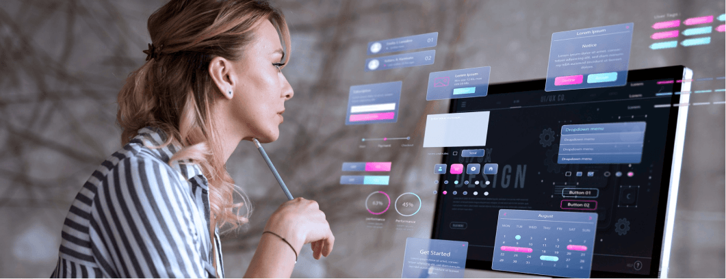 Designer reviewing holographic app interface elements on a monitor