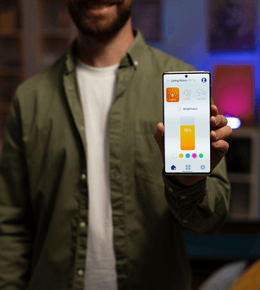 Person presenting a finished mobile app on a smartphone