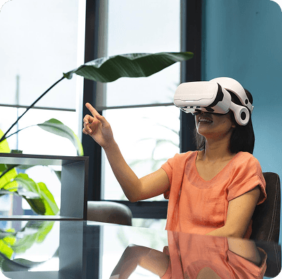 Woman wearing a VR headset and interacting with a virtual interface