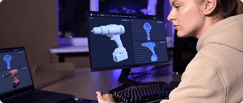 Designer creating a 3D product model on dual monitors