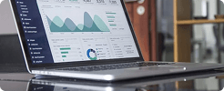 Laptop showing education analytics and reporting dashboards