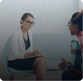 Healthcare professional consulting with a patient
