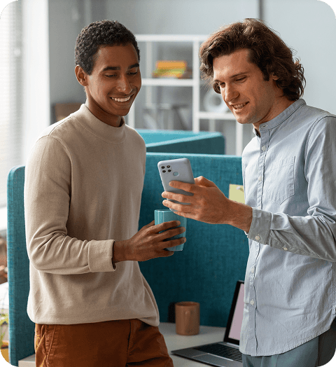 Service team members reviewing a delivery app on a smartphone