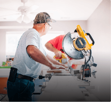 Technician performing home maintenance with power tools