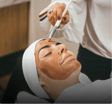 Person receiving a facial beauty treatment