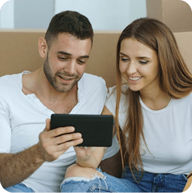 Couple reviewing property information on a tablet