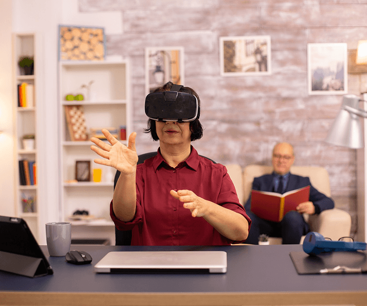 Woman using a VR headset to visualize a property interior
