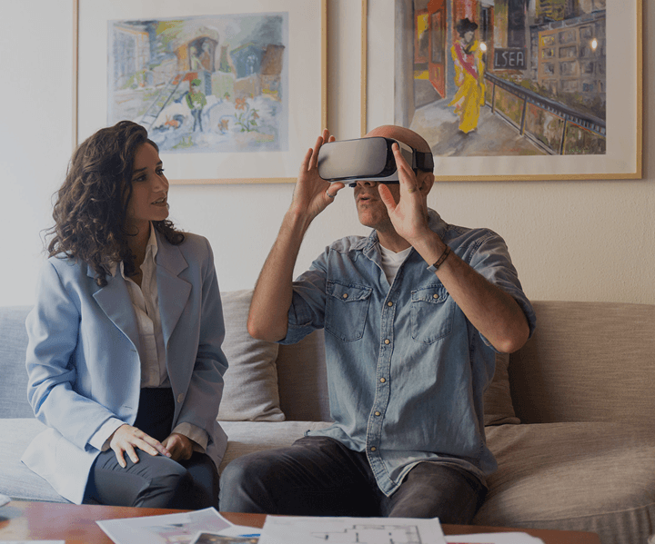 Couple experiencing a virtual property tour with a VR headset