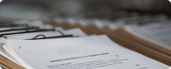 Organized property documents clipped on a desk