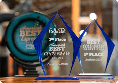 Awards and trophies on a wood surface