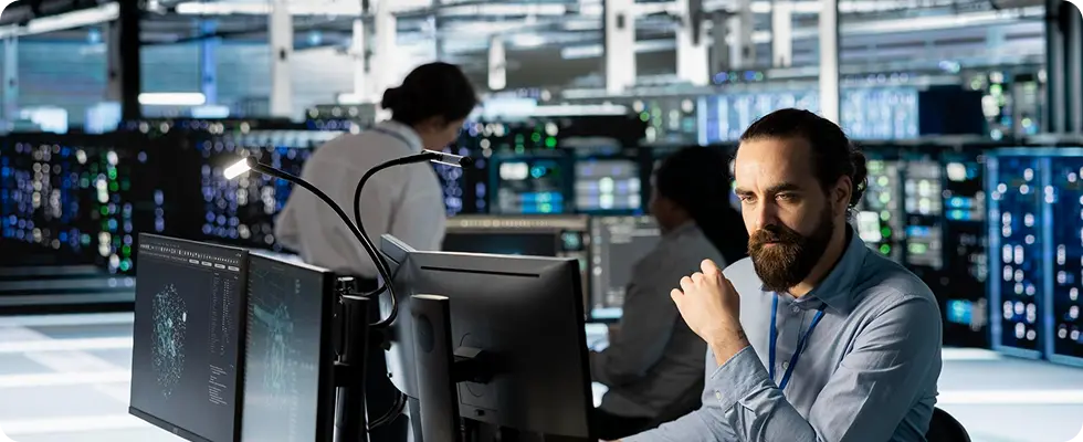 Engineers monitoring systems in a datacenter operations room