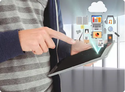 Person using a tablet with floating cloud and application icons